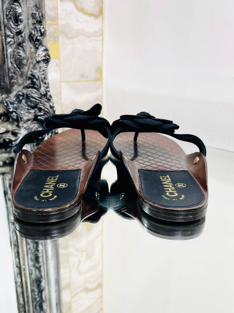 Chanel flip flops with on sale flower